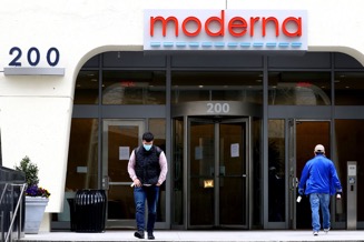 A group of people walking in front of a store
Description automatically generated